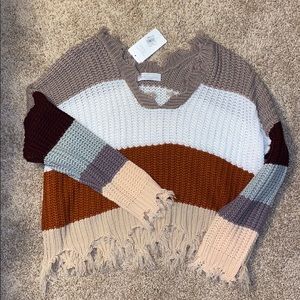 Multi color striped v sweater never been worn